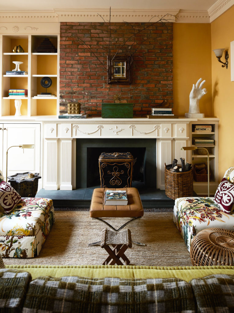 Renovated Living room with a white fireplace as the focal point. 