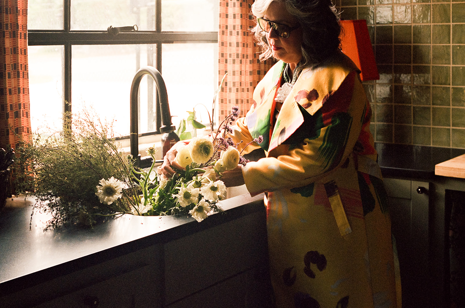 Amity styling a floral arragment on how to design an easy-to-clean home.
