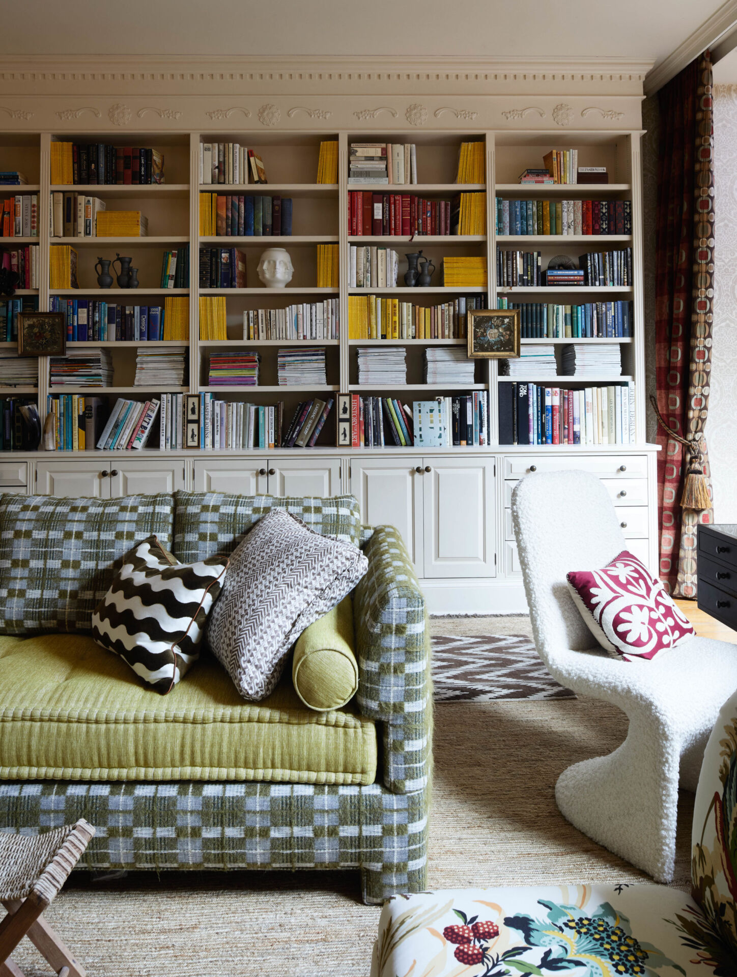 Filled-up bookcase showing how to design an easy-to-clean home.